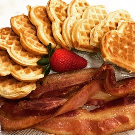 Our waffles are served with real bacon and whipped cream.