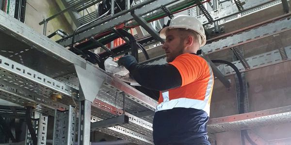 Engineers carrying out maintenance and service work on industrial systems, ensuring safe operation,