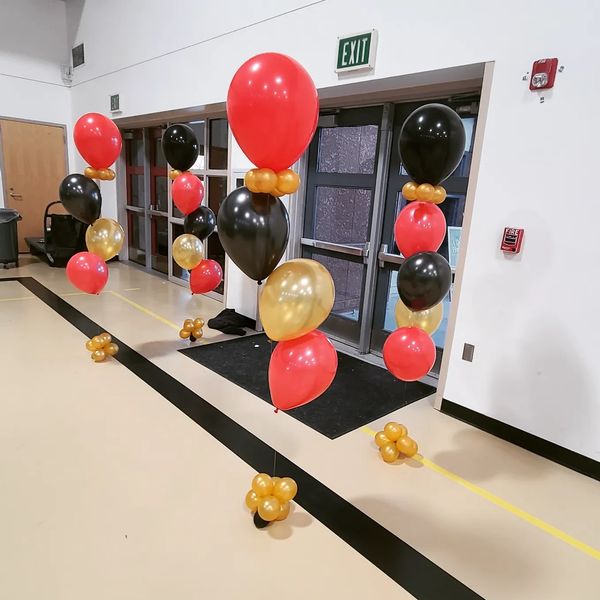 Red, Gold, Black balloons, Photo Booth rental, Flower wall rental, balloon garlands for parties