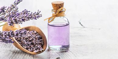 Dried lavender and lavender oil on table