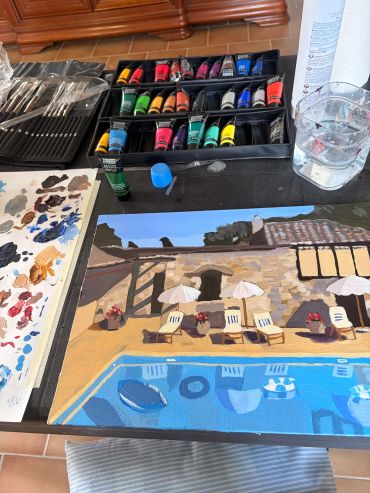 Acrylic paint set and painting of a poolside scene in France .