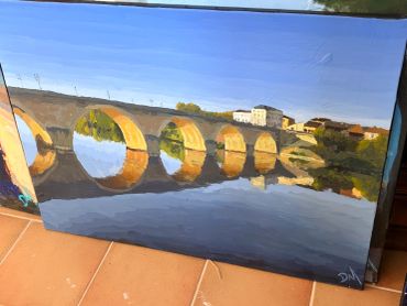 Painting of a bridge with arches over the Dordogne, France reflecting the sky.