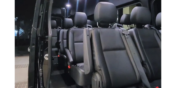 The illuminated interior of our passenger Mercedes-Benz Sprinter Van. Complete with USB-C chargers