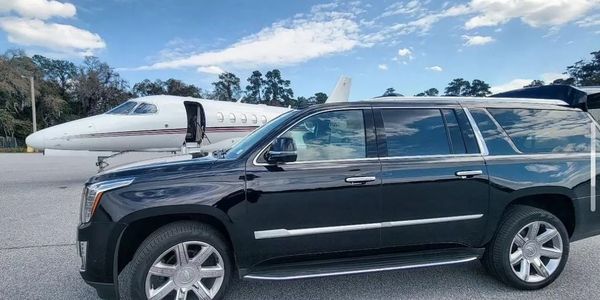 A black Cadillac Escalade ESV provides on the tarmac service at Signature Hilton Head Island