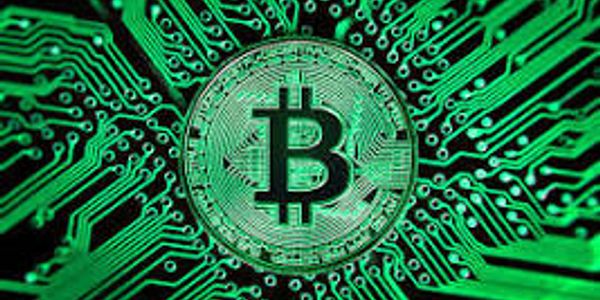 Green circuit board with Bitcoin logo.