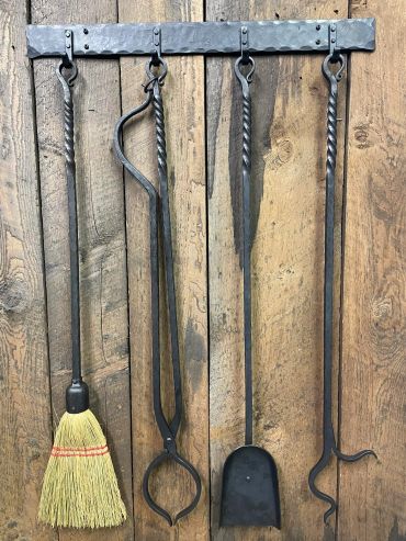 custom hand-forged wrought iron wall rack with hooks for fireplace tools
