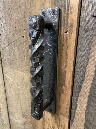 Custom hand-forged wrought iron door handle geometric twist