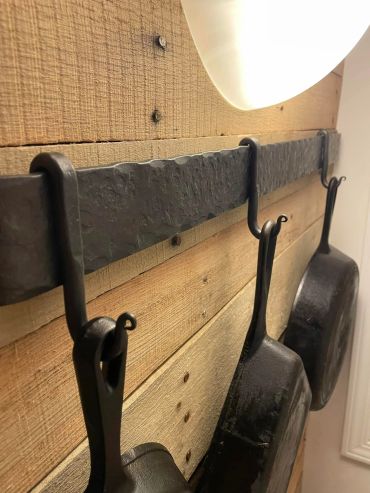custom hand-forged wrought iron wall rack with hooks for pots and pans