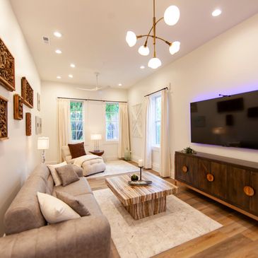 Bright and cozy living room with modern decor and warm lighting.