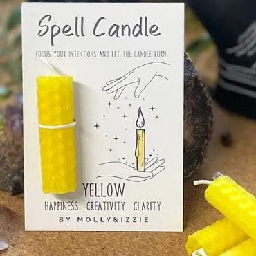 Yellow spell candle for happiness, creativity, and clarity.