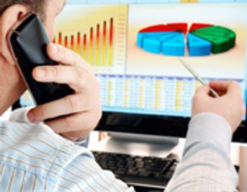 A Person talking on phone with statics before him