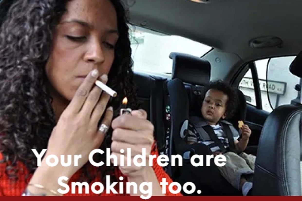 Mother lighting a cigarette around her child not realizing how hazardous it is to his overall health