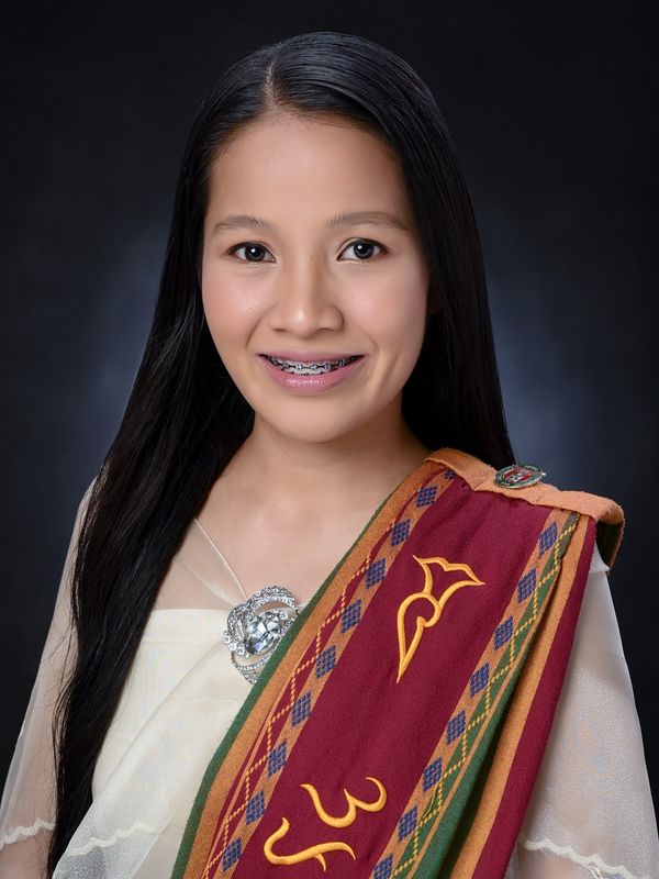 Kyla is smiling at the camera