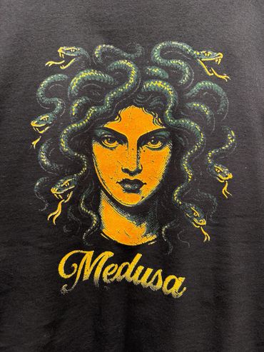5 color screen printed image of a medusa head on a black t shirt close up
