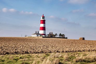Happisburgh Lighthouse, Norfolk countryside landscape/ blue skies
