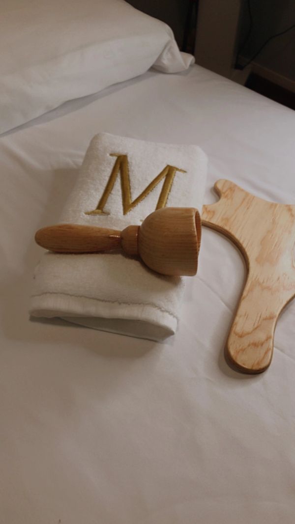 spa towel with letter M printed on it