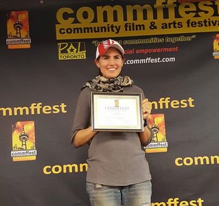Nicole Zwiren, director of Behind the Fear, receiving an award at Commffest in Toronto, Canada.