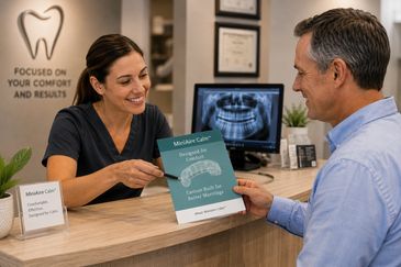 Dentist showing a patient a brochure about custom mouth guards.