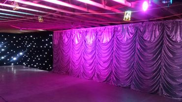 Barn conversion with Austrian festoon ruffled drapes