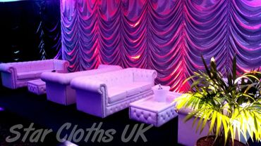 Silver Austrian drape lit with purple washes