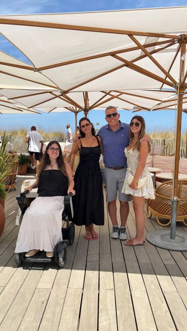 A three woman with man Where in sunglasses and looking ahead