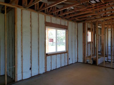 Insulated walls under construction inside a house.