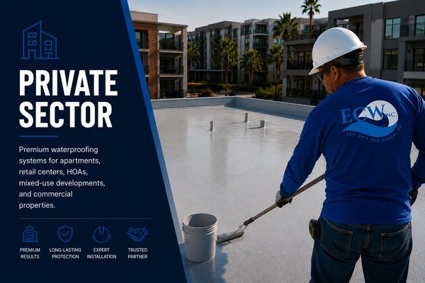 Worker applying waterproofing on a rooftop in a residential complex.