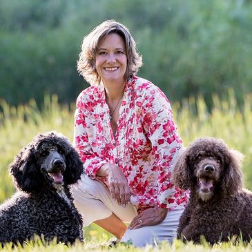 Woman smiling with two dogs