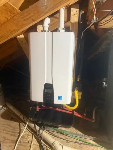 Navien tankless water heater install in attic by Serrano’s Plumbing Services in Southeast Louisiana.