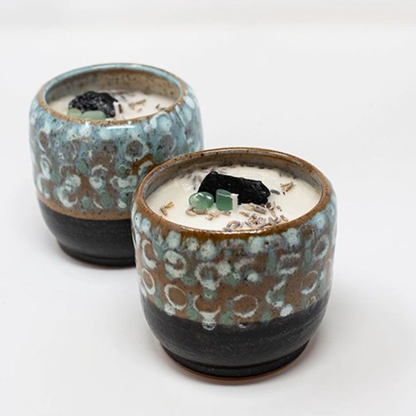 Two bowls of food on a table.