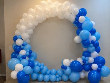 Blue and white balloon arch decoration.