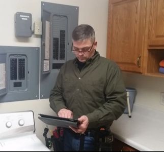 Home Inspector Perry Stafford doing a Home Inspection in Prudenville.