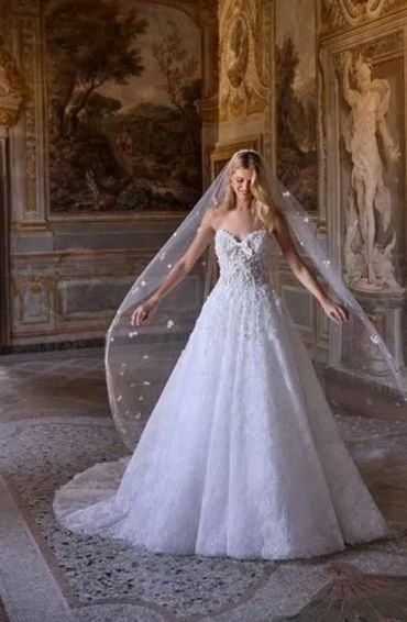 wedding dress strapless sweetheart neckline with bow detail. The entire gown is crafted from delicat