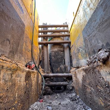 Deep excavation and municipal pipe repair
