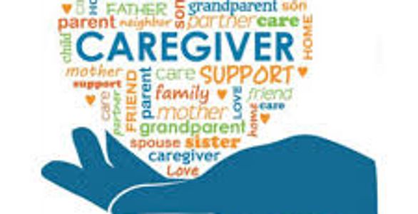 Hand holding a heart-shaped word cloud about caregiving and family support.