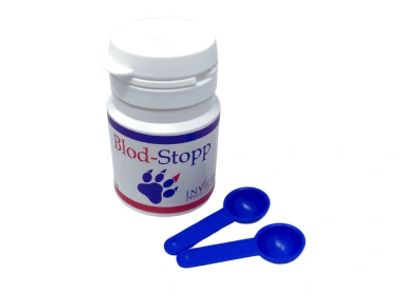A white bottle labeled Blod-Stopp with two blue measuring spoons.