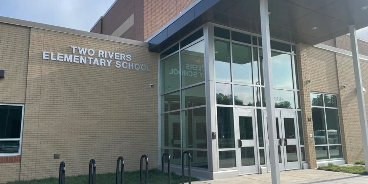 Entrance of Two Rivers Elementary School with glass doors.