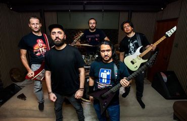 Bashar Haroun with Prosecuted heavy metal band