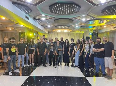 Bashar Haroun in the middle with the participants of one of Music House's events