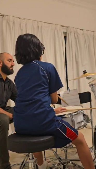 Bashar Haroun with his drums student