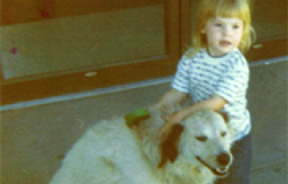 photograph of lisa as a small child with a dog
