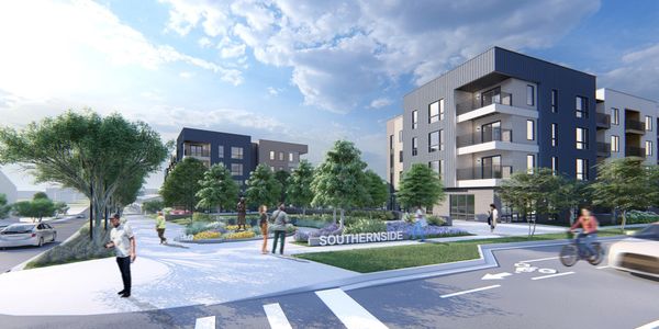 Modern residential complex with greenery and people.