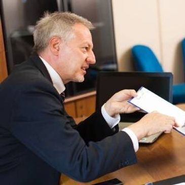 Man reviewing legal settlement documents.