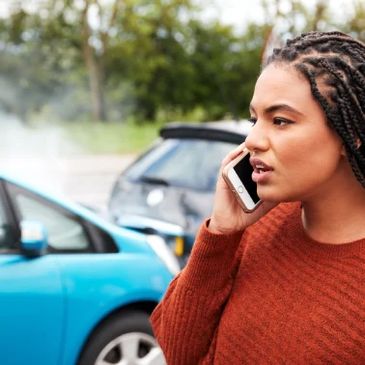 Woman on phone after accident.