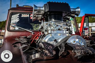 Close-up of a powerful supercharged engine on a vintage truck.