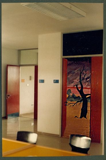 Another mural door showed a surreal landscape. In the background is a real door to a real classroom.