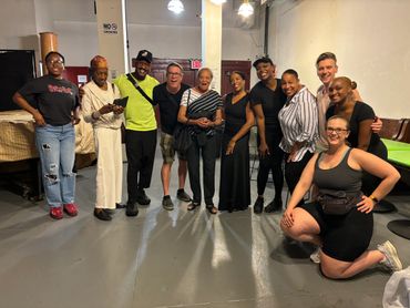 Playwright David McDonald surrounded by the cast and crew of Ella The Ungovernable