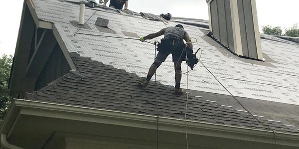 Roofing technicians at work.