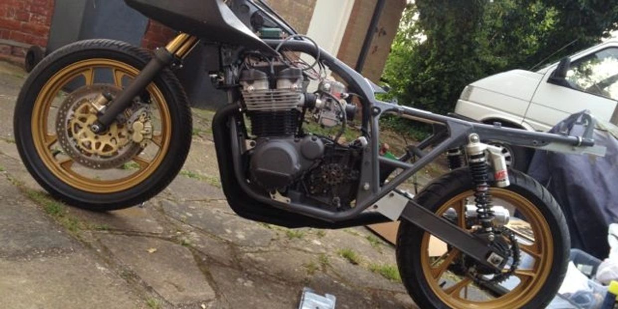 It’s grey and it holds the back wheel in, and it’s probably not worth £400. But there you go.