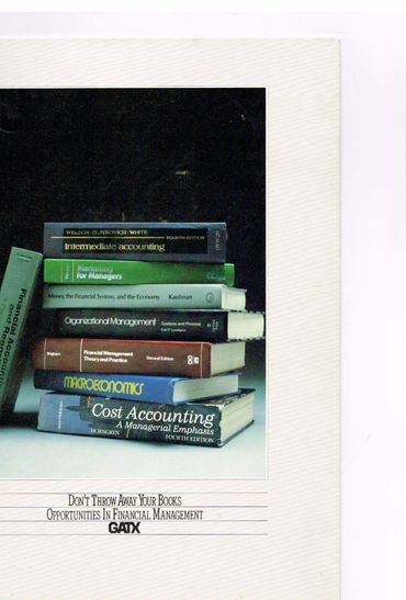 Stack of financial management and accounting books with motivational text.